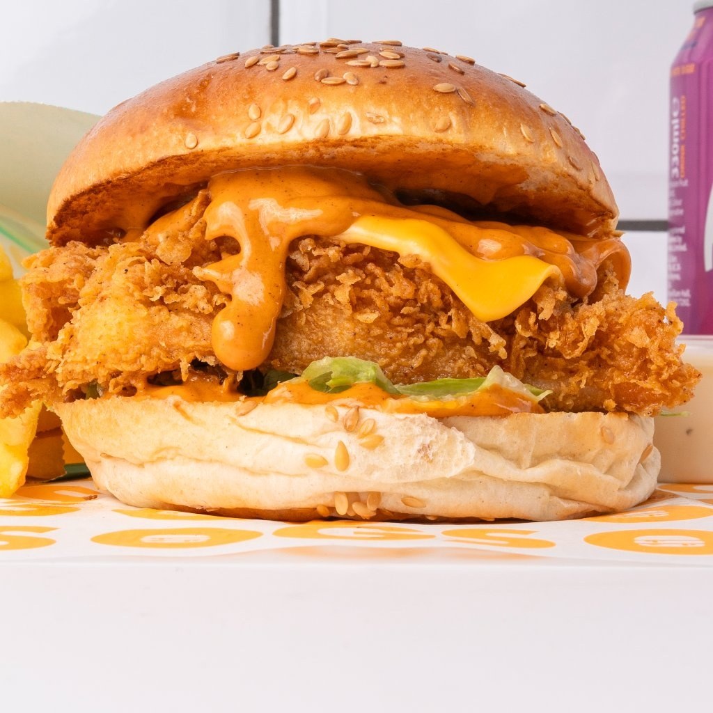 OGS Nashville crispy chicken burger with cheese and sauce